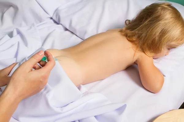 Woman making injection by syringe in child — Stock Photo, Image