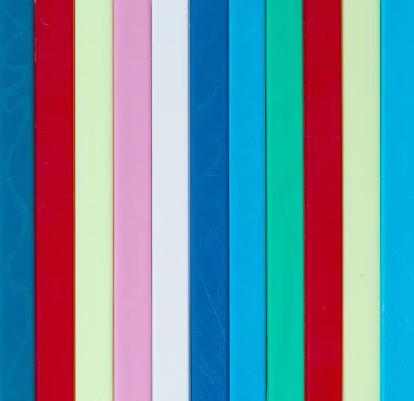 Colorful striped background. Plastique sticks of different color — Stock Photo, Image