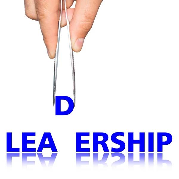 Hand with  forceps and  word leadership — Stock Photo, Image