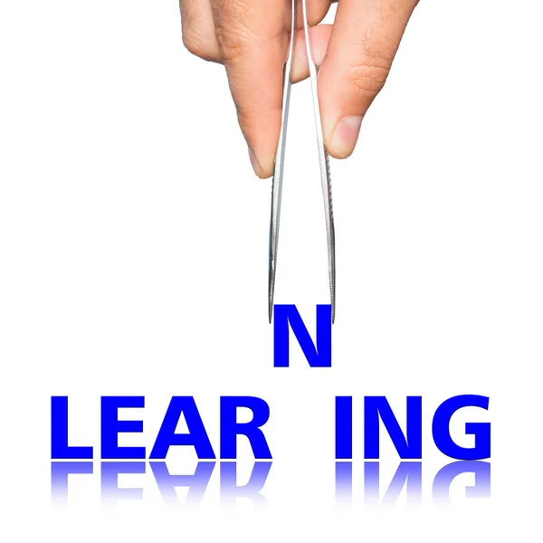 Hand with  forceps and  word learning — Stock Photo, Image