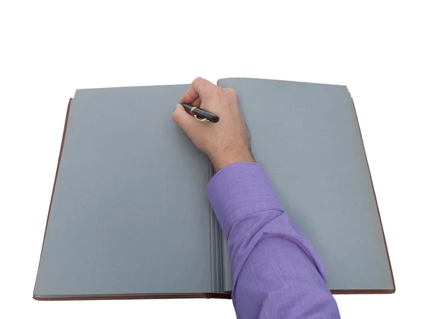 Hand skriva i öppna gamla anteckningsbok — Stockfoto