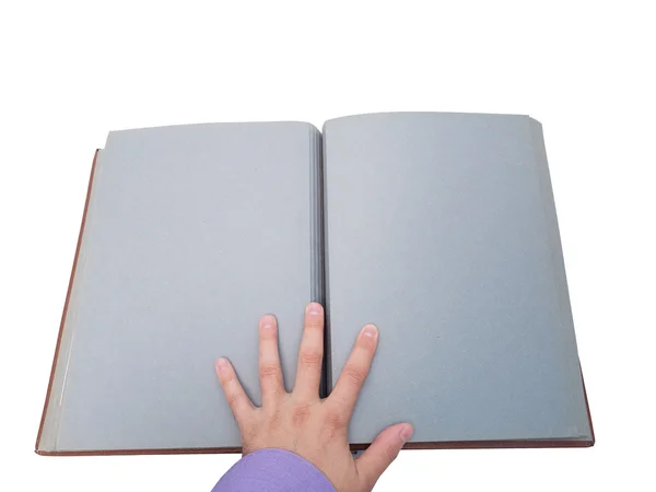 Hand schlägt ein altes Buch auf. — Stockfoto