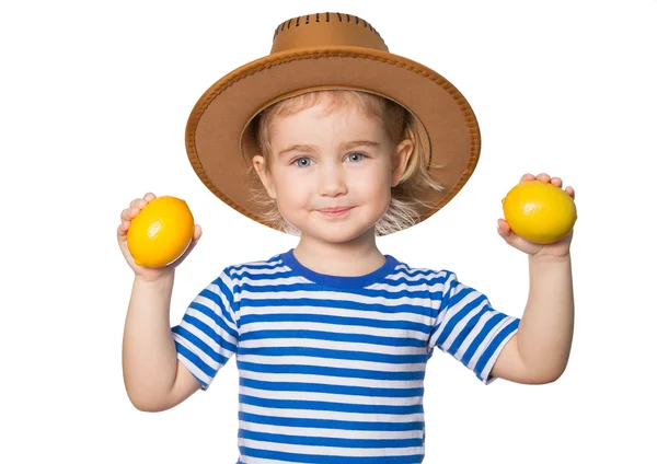 Little Funny girl keeps lemons — Stock Photo, Image