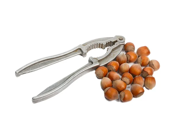 Metal pliers to crack nuts and hazelnuts — Stock Photo, Image