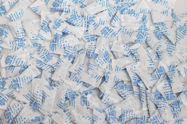 Desiccant silica on the pack. Closeup view. packet of silica gel buried in silica crystals