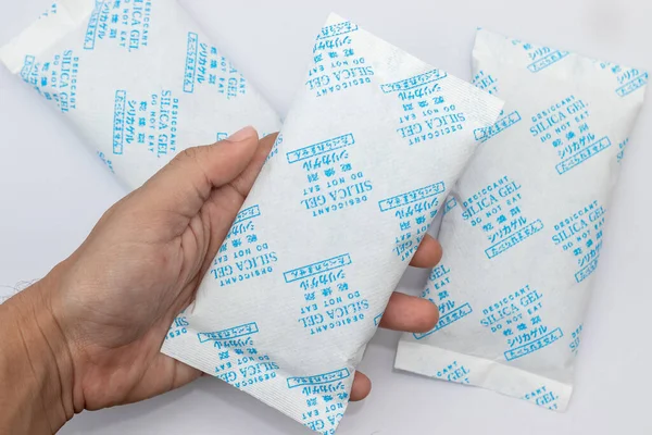Desiccant silica on the pack. Closeup view. packet of silica gel buried in silica crystals