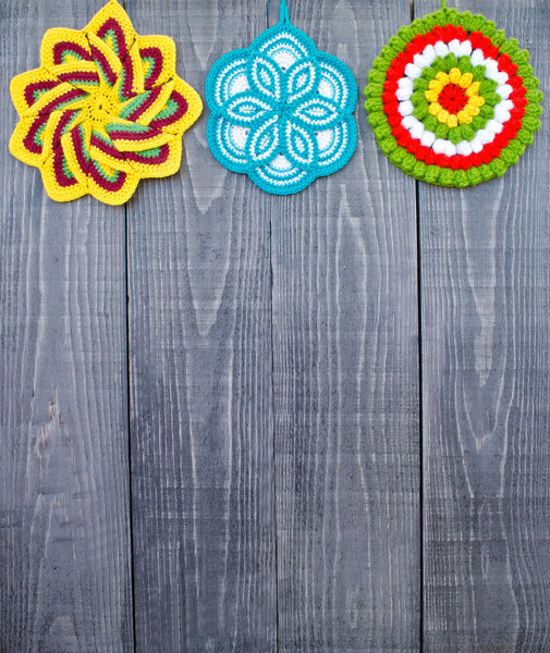 Knit flower potholders.