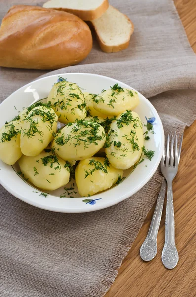 Boiled potatoes and bread — Stock Photo, Image