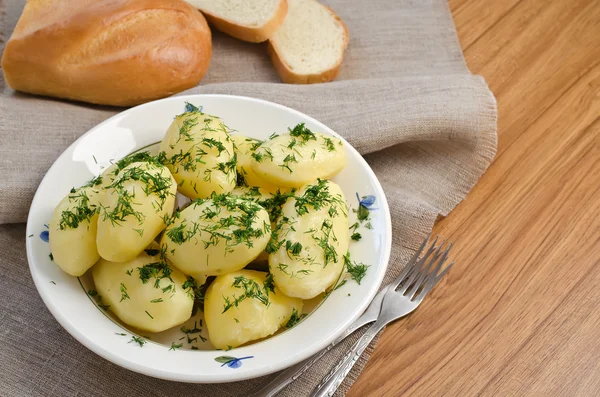 Boiled potatoes and bread — Stock Photo, Image