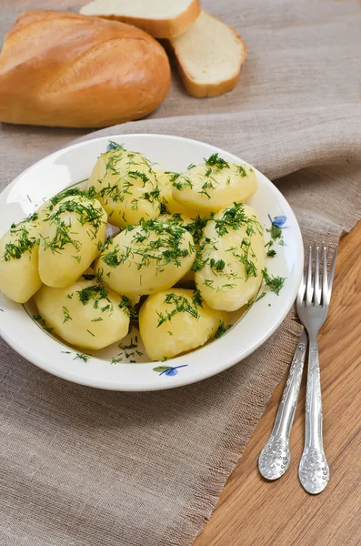 Boiled potatoes and bread — Stock Photo, Image