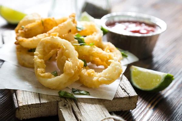 Fried squid rings on table