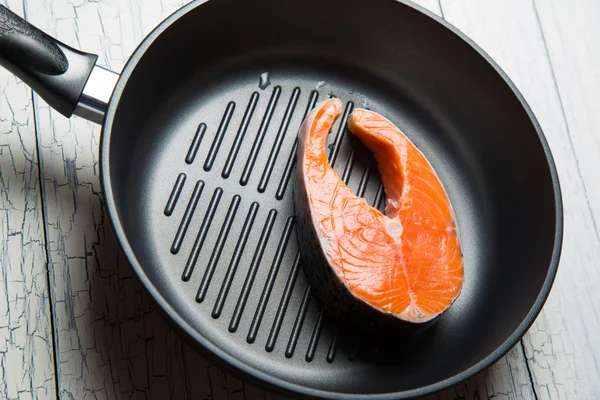 Fresh salmon steak on the grill pan — Stock Photo, Image