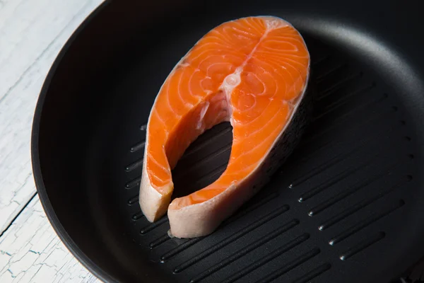 Fresh salmon steak on the grill pan — Stock Photo, Image