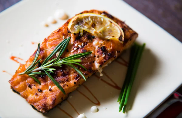 Salmon fillet with lemon and rosemary — Stock Photo, Image