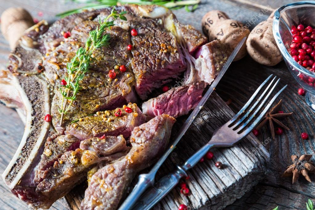 Grilled beef steak on the bone — Stock Photo © rus7 76776557