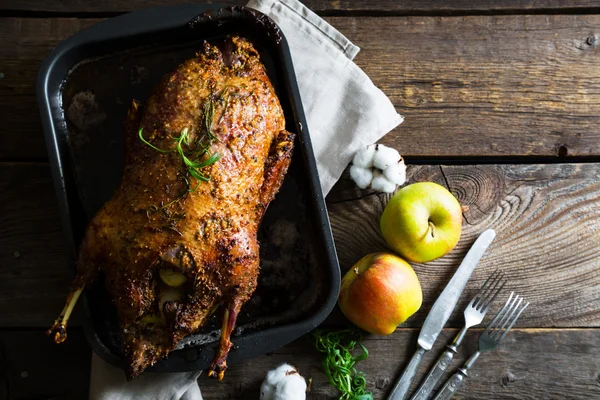 Roasted goose with apples in a rustic style — Stock Photo, Image
