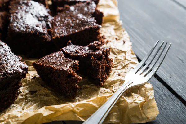 Homemade brownies on black table — Stock Photo, Image