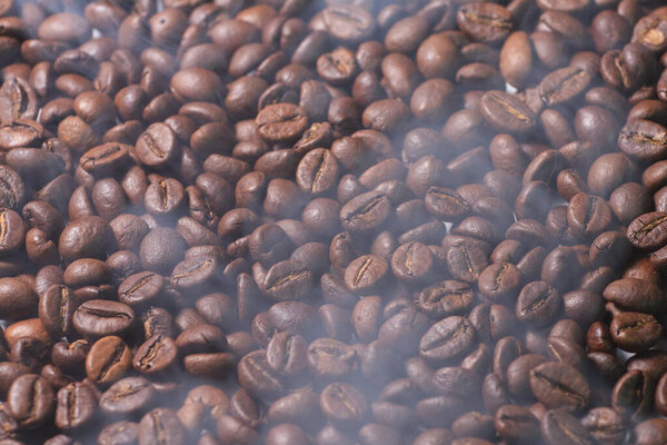 Coffee beans texture with smoke of prepared hot coffee