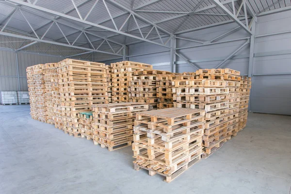 many wooden crates in empty storage facility