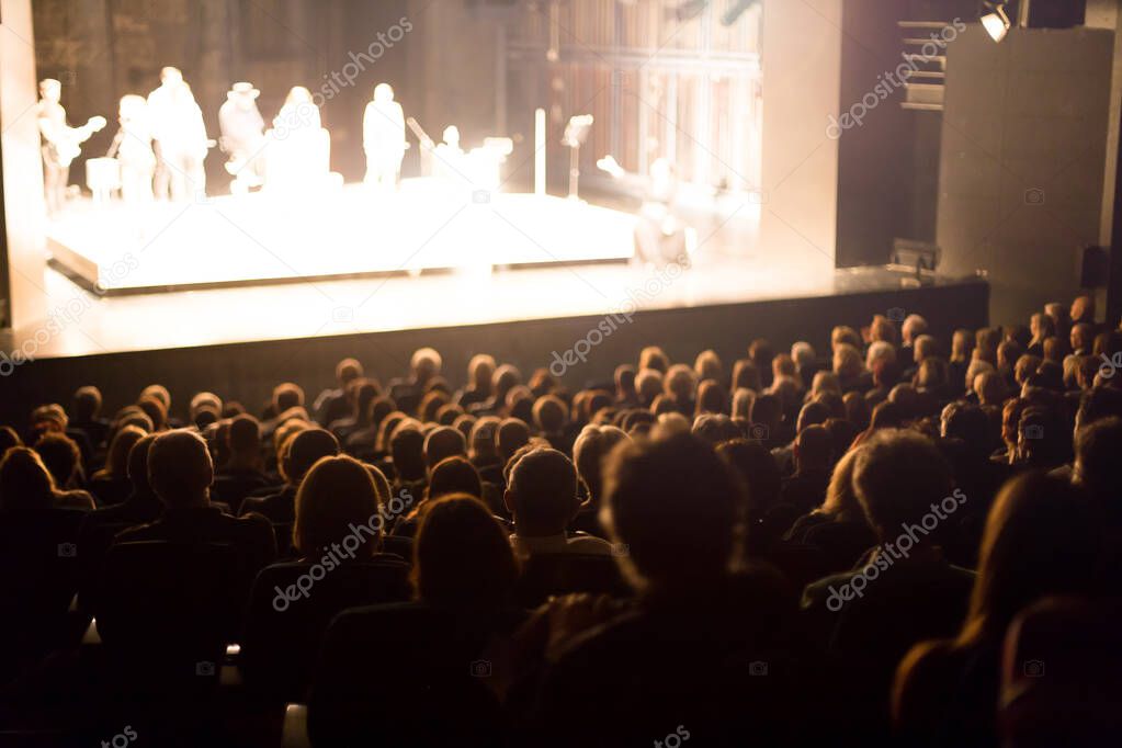 theater audience watching the play