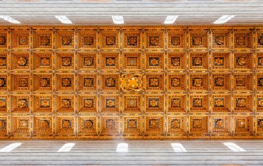 PISA, ITALY - MAY 31, 2018: Wooden coffered ceiling of Roman Catholic Pisa Cathedral at Piazza dei Miracoli (Piazza del Duomo), an important center of European medieval art and famous UNESCO World Heritage Site clipart