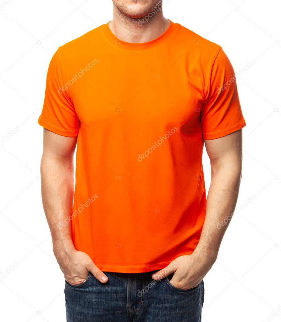 Young fit man wearing blank orange shortsleeve cotton T-Shirt. Mock up template isolated on a white background