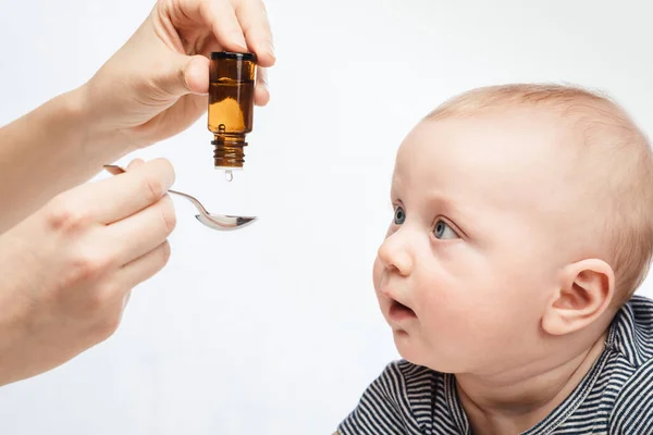 Mother Feeding Baby Boy Vitamin Liquid Medicine Using Spoon — Foto Stock