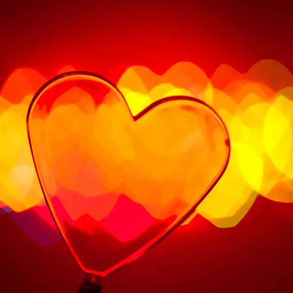 Red transparent plastic heart — Stock Photo, Image