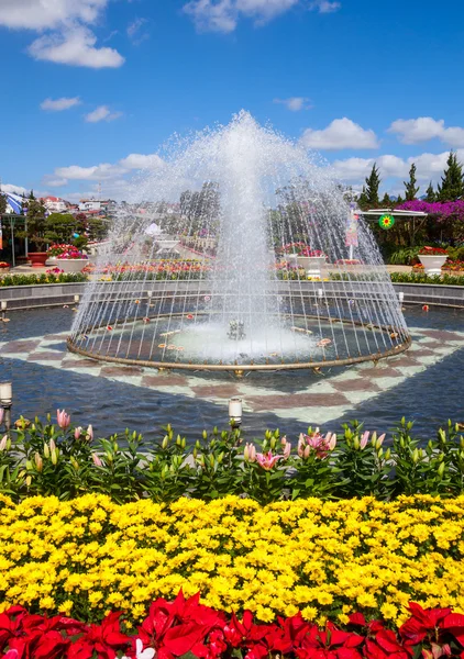 Fountain with blooming flowers — Stock Photo, Image