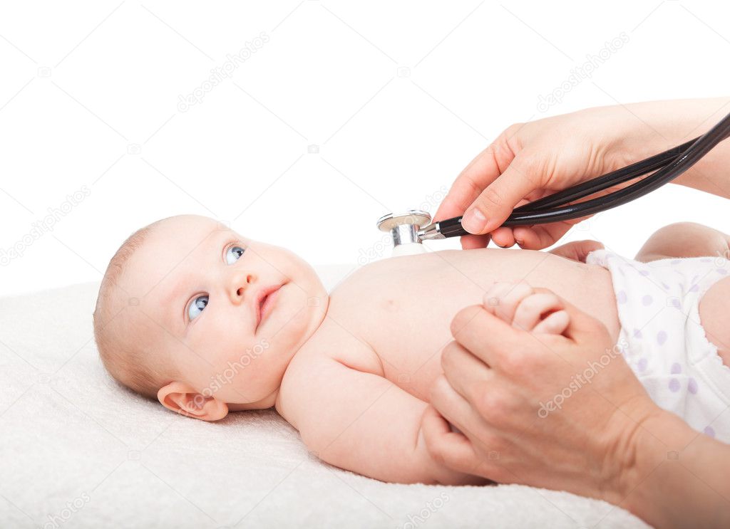 Pediatrician examines little baby girl