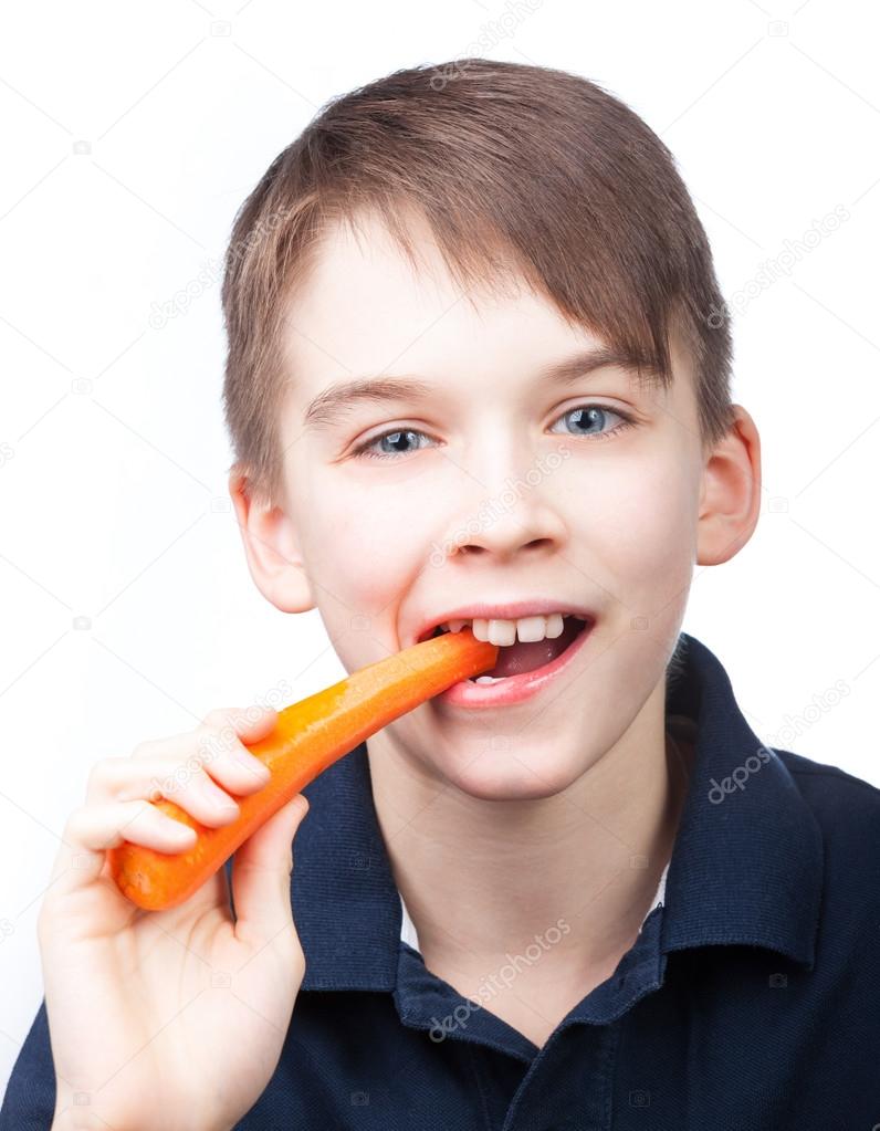 Child eats carrot