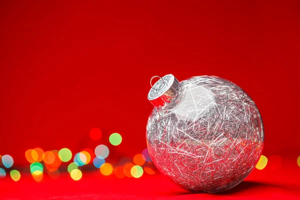 Christmas bauble on red background — Stock Photo, Image