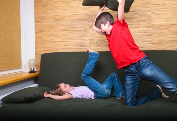 Siblings having pillow fight — Stock Photo, Image