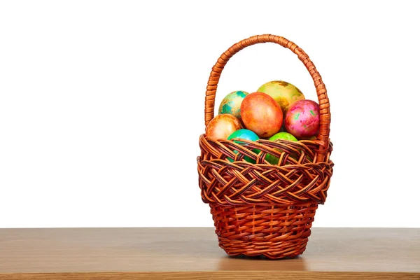 Painted easter eggs in basket — Stock Photo, Image