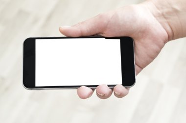 Boş ekran ile el ele tutuşan cep telefonu