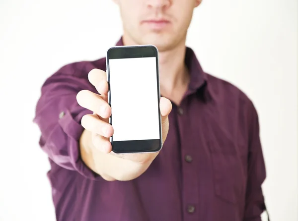 Mão segurando telefone celular com tela em branco — Fotografia de Stock