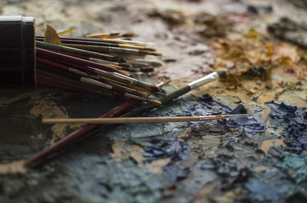 Detail of painters brushes on palette — Stock Photo, Image