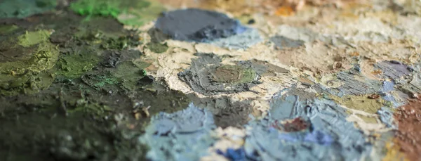 Cropped detail of dry oil paint on a palette — Stock Photo, Image