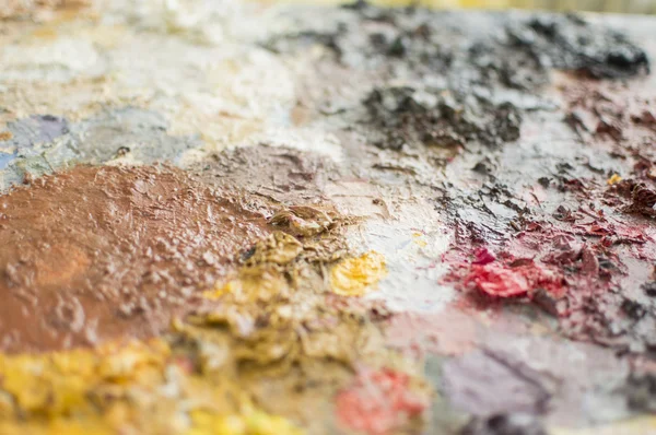 Dry oil paint on a painting palette — Stock Photo, Image