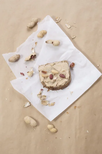 Peanuts and peanut butter on unleavened bread — Stock Photo, Image