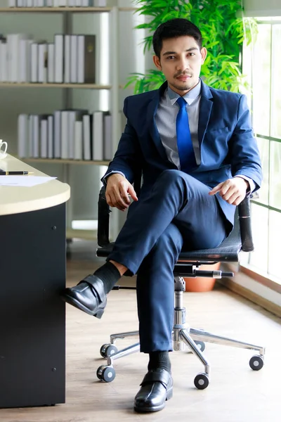 Attractive Confident Young Asian Businessman Sits Chair Leg Crossed Office — Stock Photo, Image