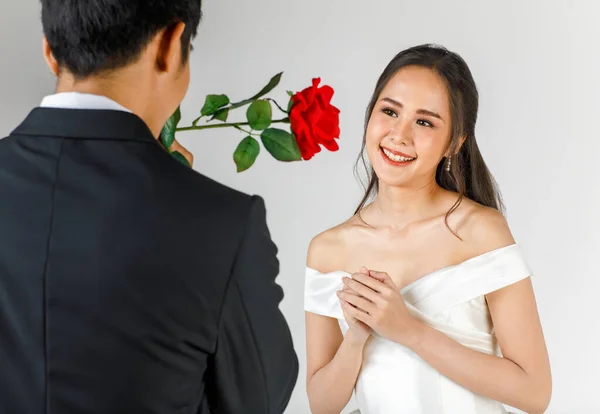 Back Man Wearing Black Tuxedo Giving Rose Young Attractive Asian — Stock Photo, Image