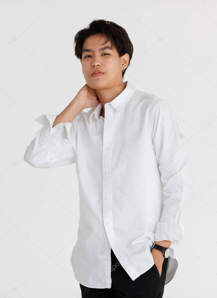 Half length shot portrait of a handsome good looking tomboy, a girl who loves to be a man, on white background.
