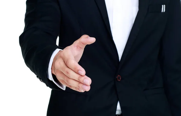 自信を持って笑顔で立って黒のスーツを身に着けているビジネスマンとして握手のために手を差し伸べて幸せ会議契約の満足の契約として — ストック写真