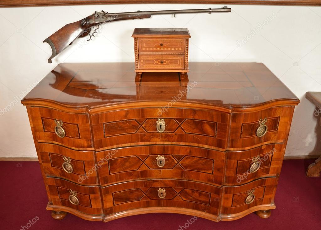 An antique chest of drawers