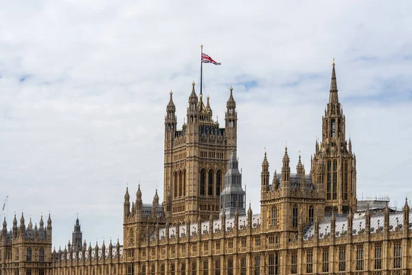 The Palace of Westminster serves as the meeting place of the House of Commons and the House of Lords, the two houses of the Parliament of the United Kingdom.