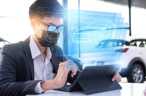 Asian man car inspection holding taplet application for service car for car futuristic vehicle graphical GUI interface intelligent car. connected car. Internet display car technician maintenance