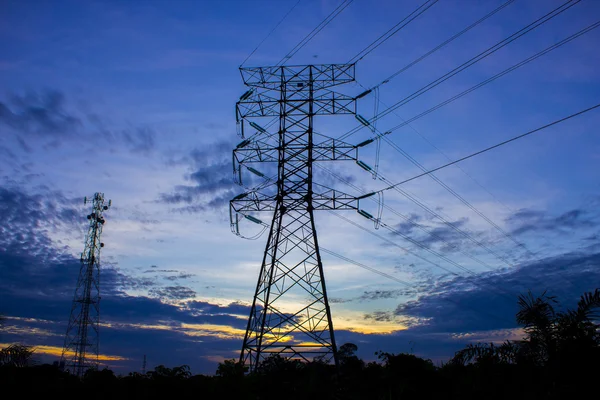 Silhouette of high voltage electricity tower — Stock Photo, Image