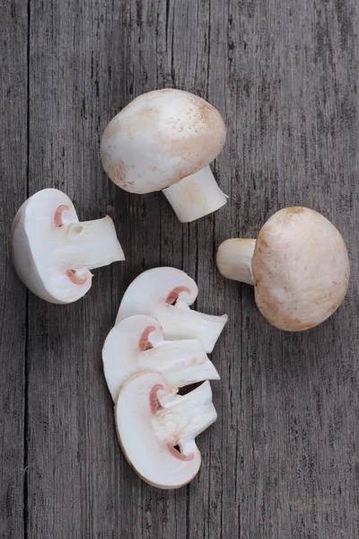 Champignons on old wood table — Stock Photo, Image