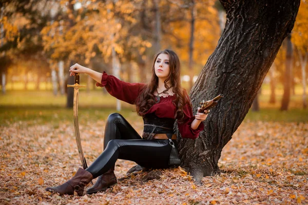 Beautiful Young Woman Saber Pistol Her Hands Sits Tree Autumn — 스톡 사진